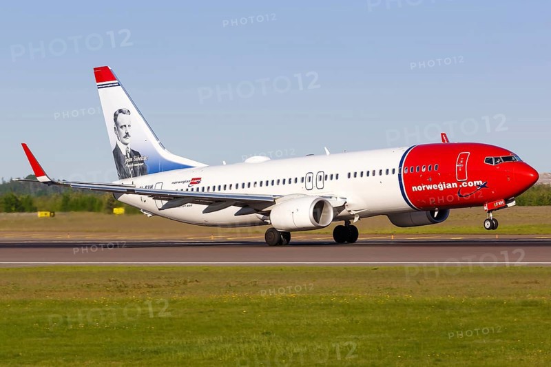 A Norwegian Boeing B737-800 with the registration EI-FVH and Jean Sibelius on the tail unit takes off from Helsinki Airport
