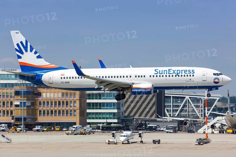 A SunExpress Boeing 737-800 with registration TC-SNZ lands at Stuttgart Airport