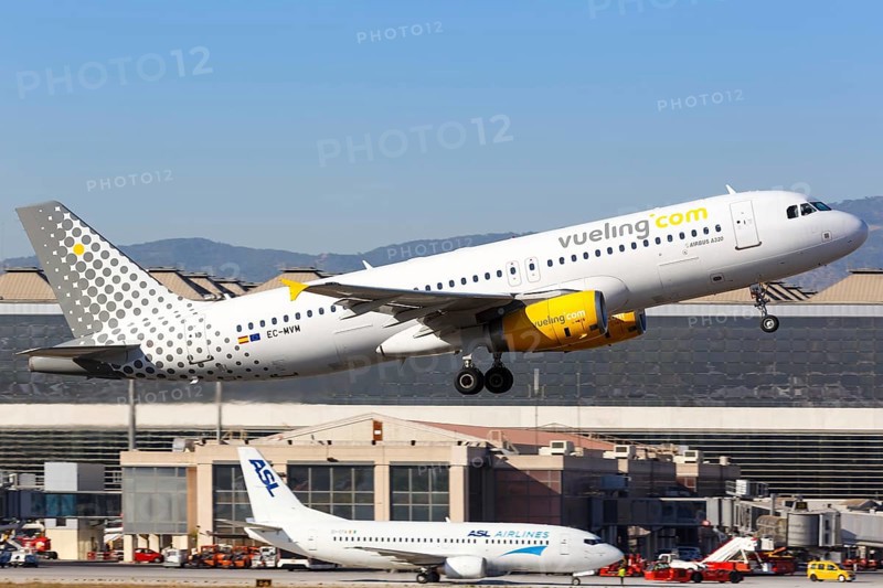 A Vueling Airbus A320 with the registration EC-MVM takes off from Malaga Airport