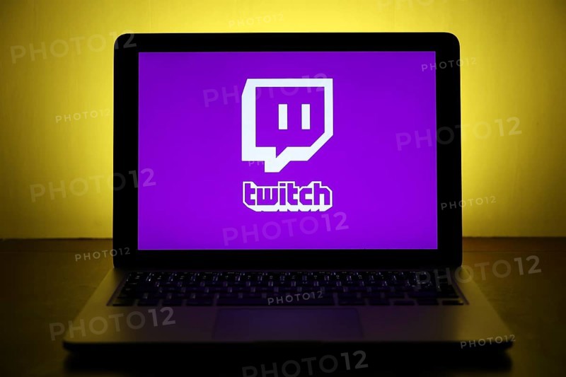 Logo of the streaming platform twitch for gamers on a laptop