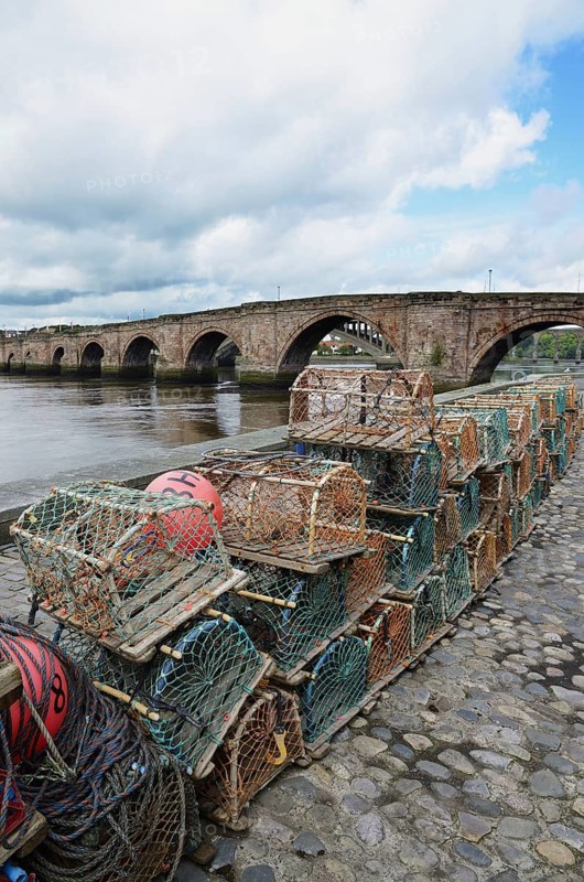 Crab fishing pots and sandstone one way bridge