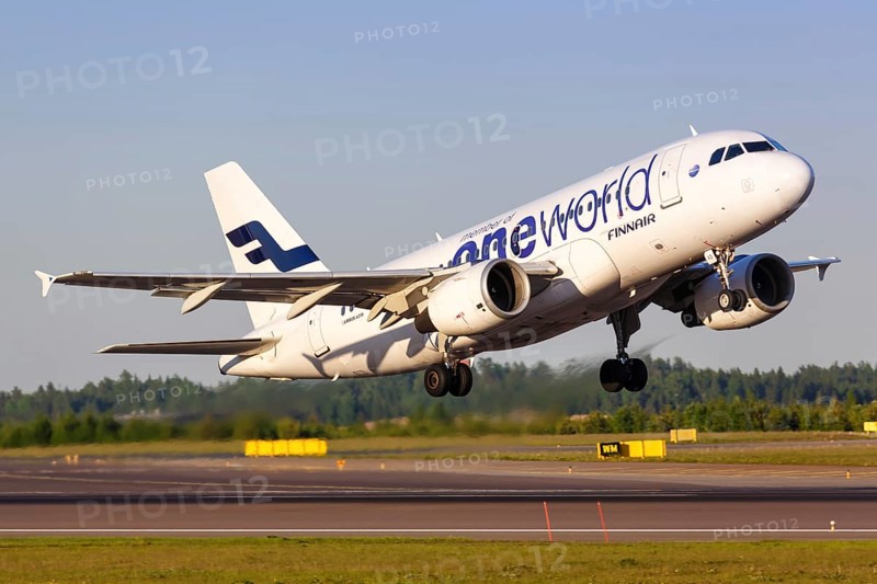 A Finnair Airbus A319 with the registration OH-LVD in the OneWorld special livery takes off from Helsinki Airport