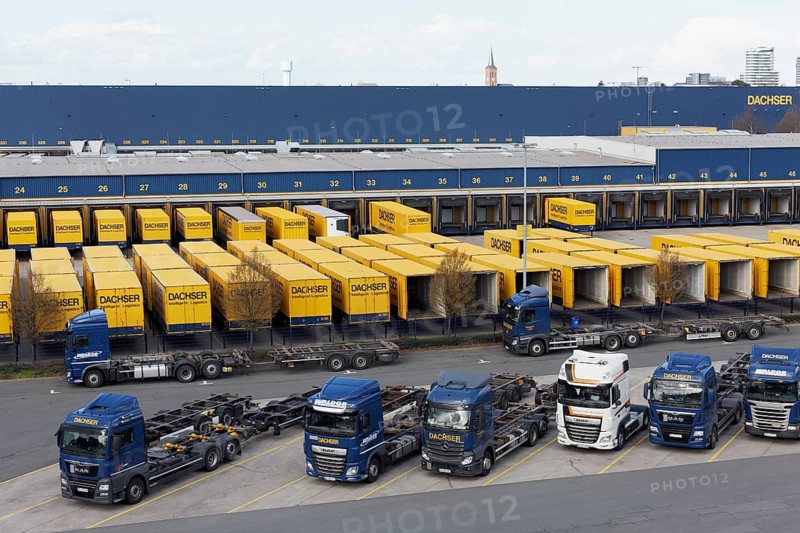 Parking lot with articulated lorry and semi-trailer