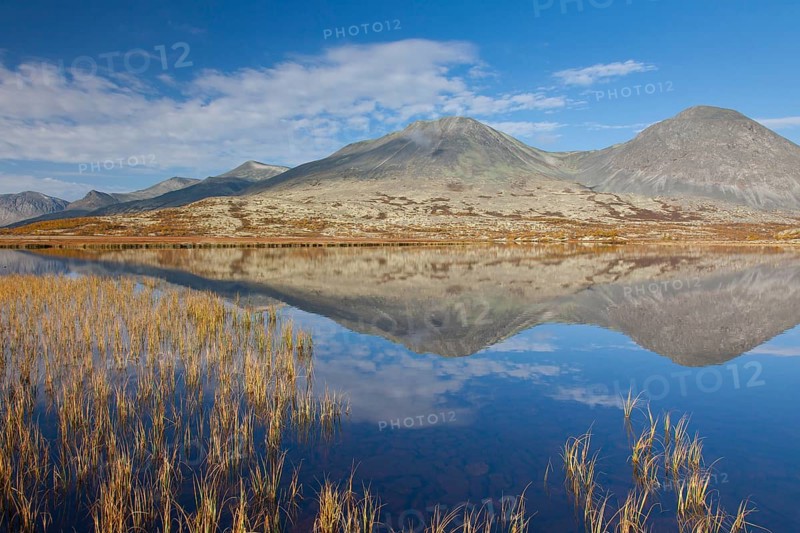 Stygghoin reflected in the water of the lake in autumn