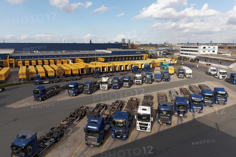 Parking lot with articulated lorry and semi-trailer
