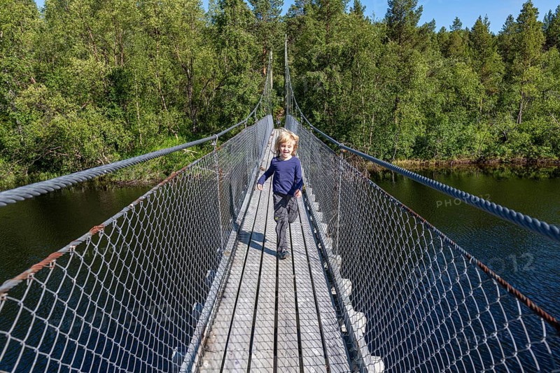 Young girl on a steel bridge