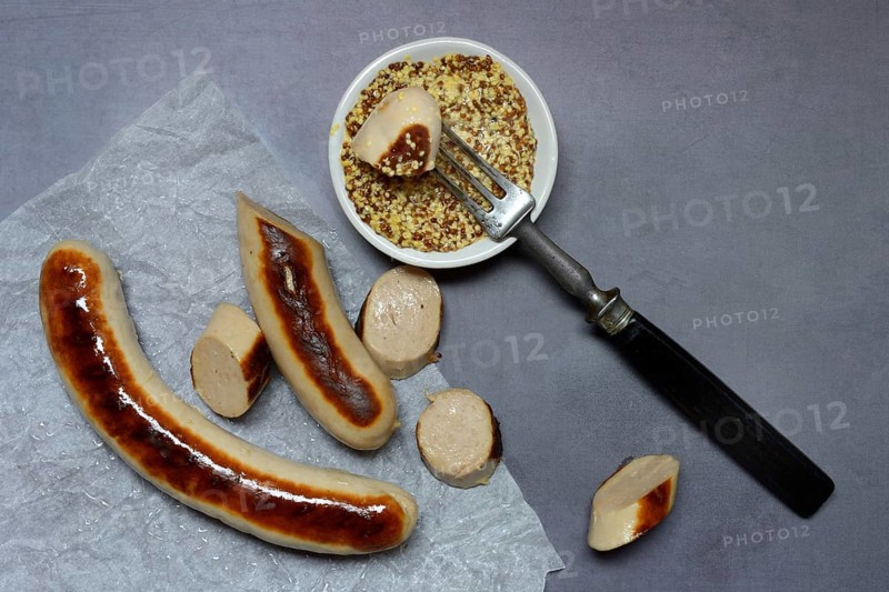 Sliced bratwurst and skin with Dijon mustard