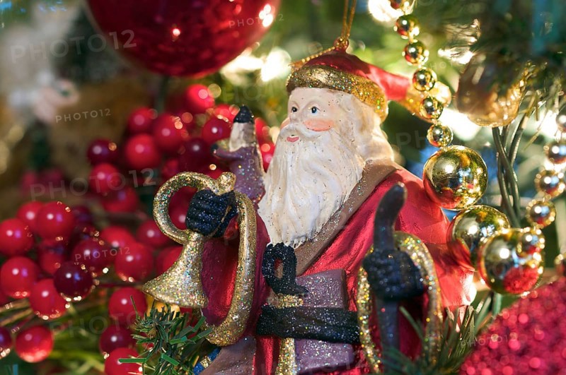 Santa ornament hanging on the christmas tree