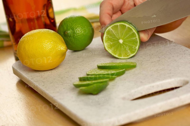 Slicing a lime on a cutting board