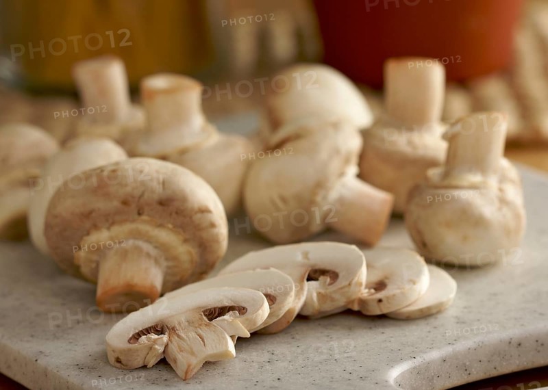 Delicious fresh sliced mushrooms on a cutting board