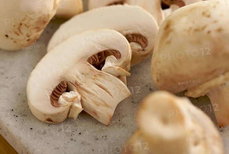 Delicious fresh sliced mushrooms on a cutting board