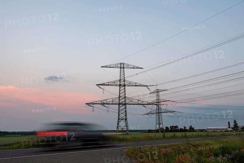 Car driving in the evening twilight
