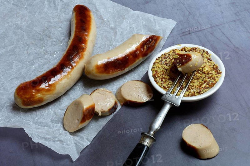 Sliced bratwurst and skin with Dijon mustard