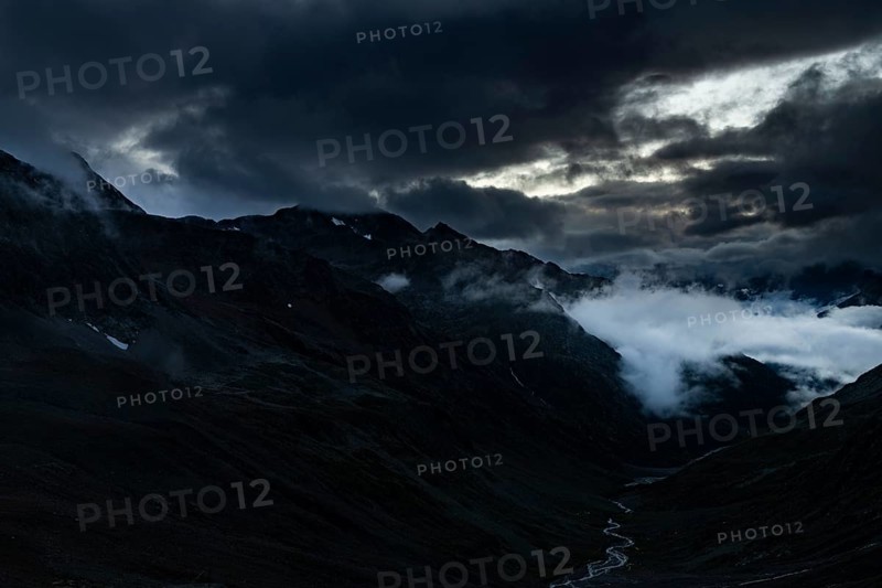 Blue hour over Windbachtal with dramatic clouds