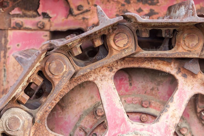 Abstract rusty vintage tractor tracks and gears