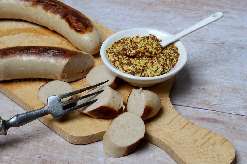 Sliced bratwurst and skin with Dijon mustard