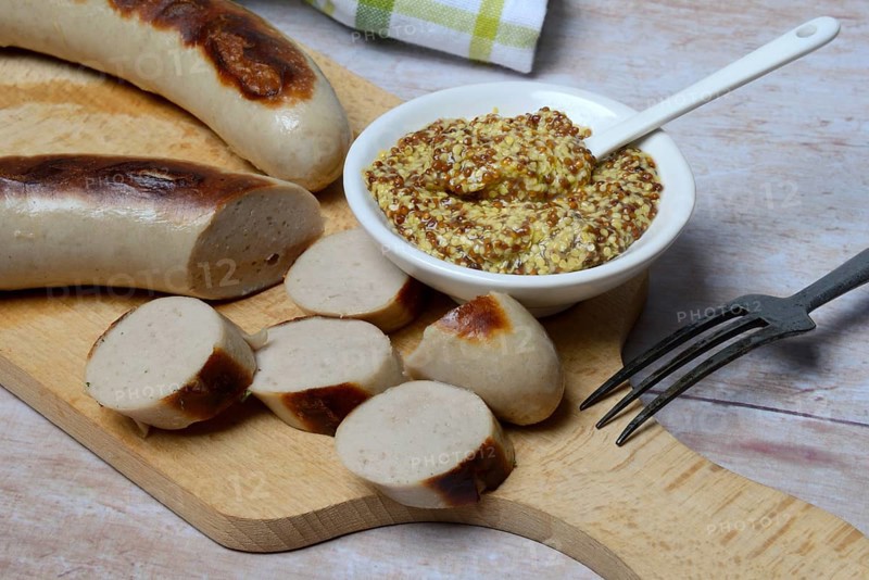 Sliced bratwurst and skin with Dijon mustard
