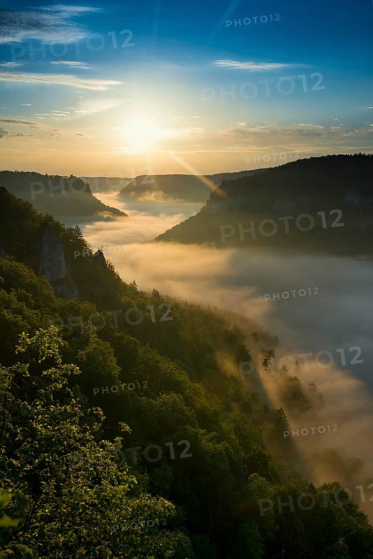 View from Eichfelsen to Werenwag Castle with morning fog