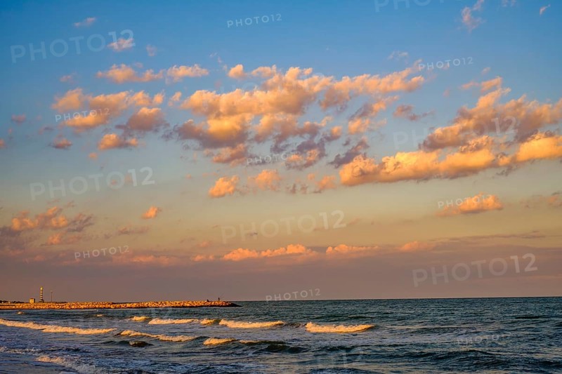 The Adriatic Sea with light waves in the evening light