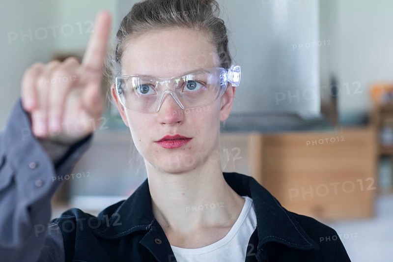 Young logistician working with scan glasses