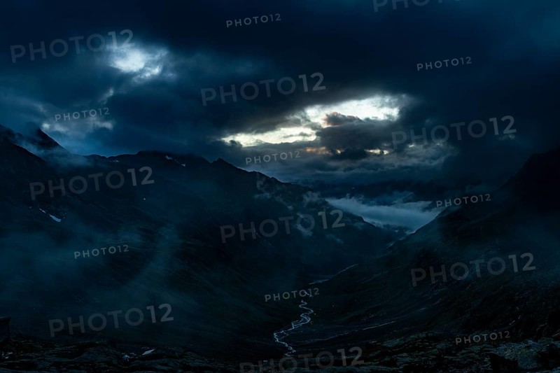 Blue hour over Windbachtal with dramatic clouds