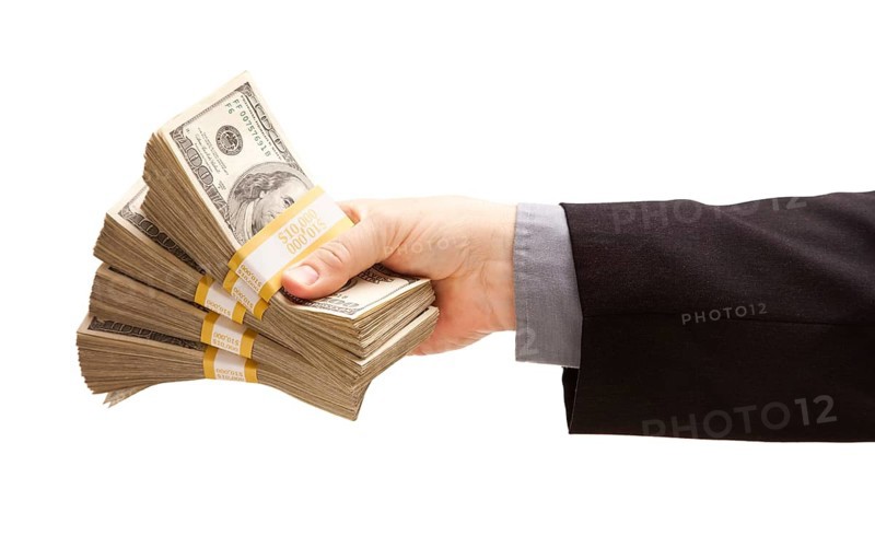 Man handing over hundreds of dollars isolated on a white background