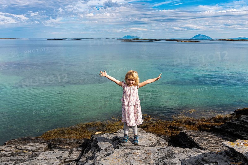 Little girl on a rock