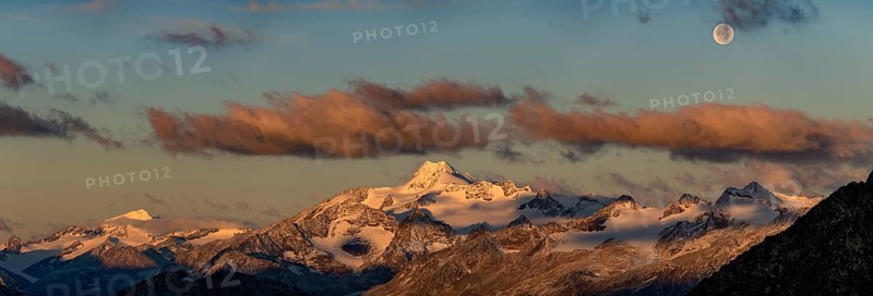 Full moon over summit of Oetztaler Wildspitze