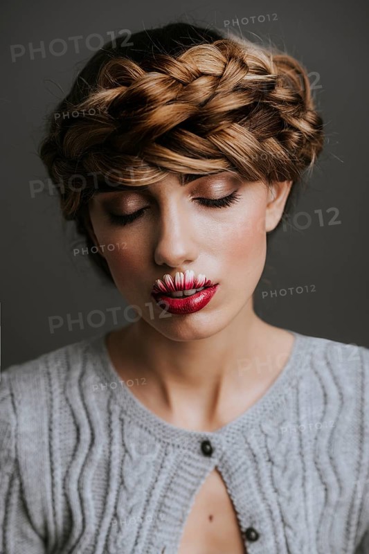 Young woman with flower lips