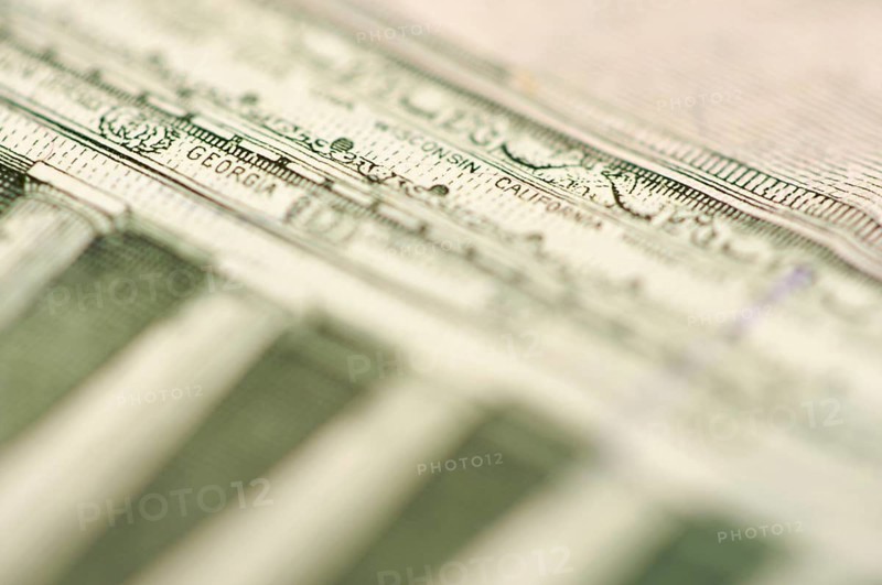 Macro of the back of the U.S. five dollar bill showing small state names as anti-counterfeit measure