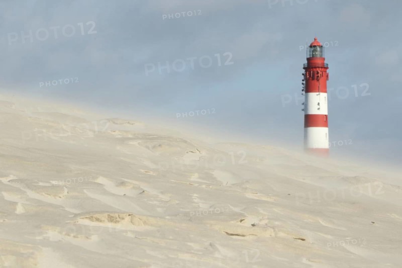 Lighthouse in dune landscape