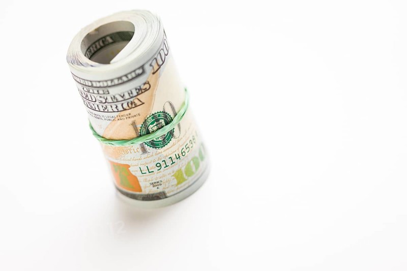 Abstract roll of newly designed U.S. one hundred dollar bills