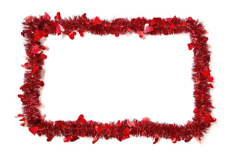 Red tinsel with hearts border frame shape on a white background ready for your own message