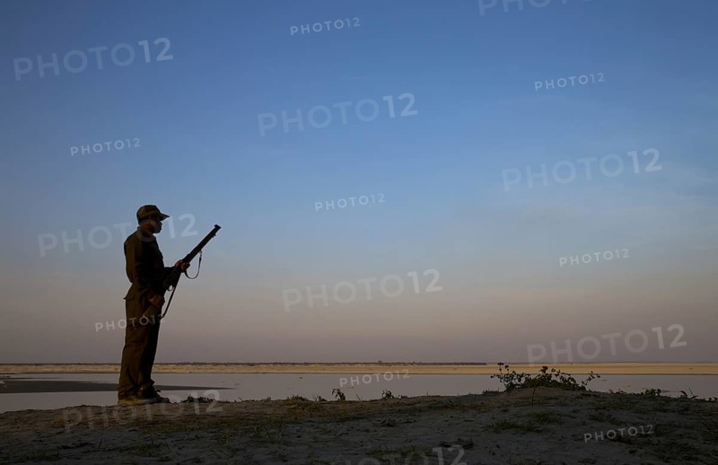 game ranger armed with rifle
