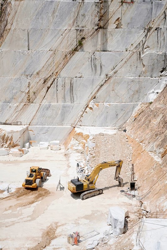 Terraced rock face in open pit Carrara marble mines or quarries