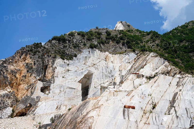 Terraced rock face in open pit carrara marble mines or quarries