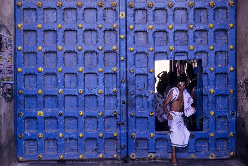 Temple priest crossing the Main door in Varadarajaswamy temple