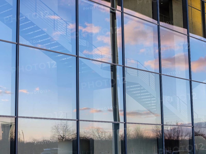 Detail glass front Paul-Loebe-Haus with stairs and reflection sky