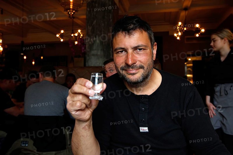 Man in Apotek restaurant drinking Brennivin