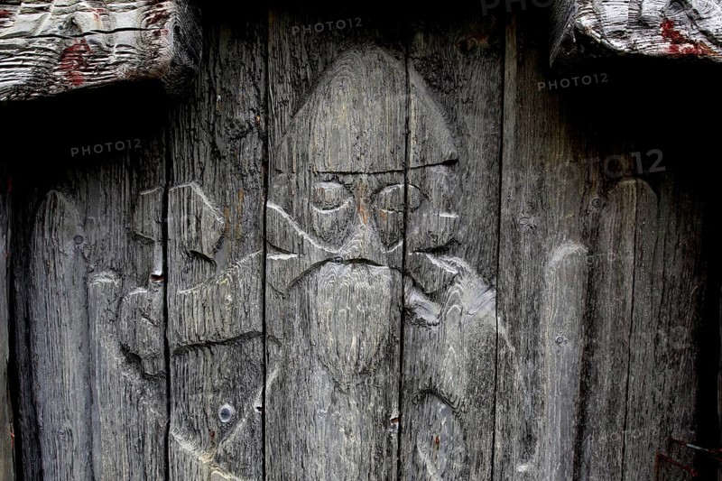 Wooden door with Viking figure