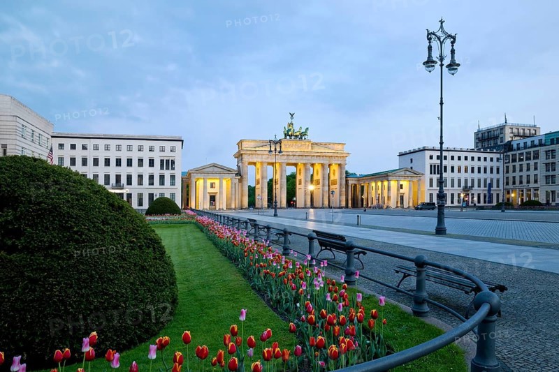 Illuminated Brandenburg Gate with Pariser Platz in the early morning