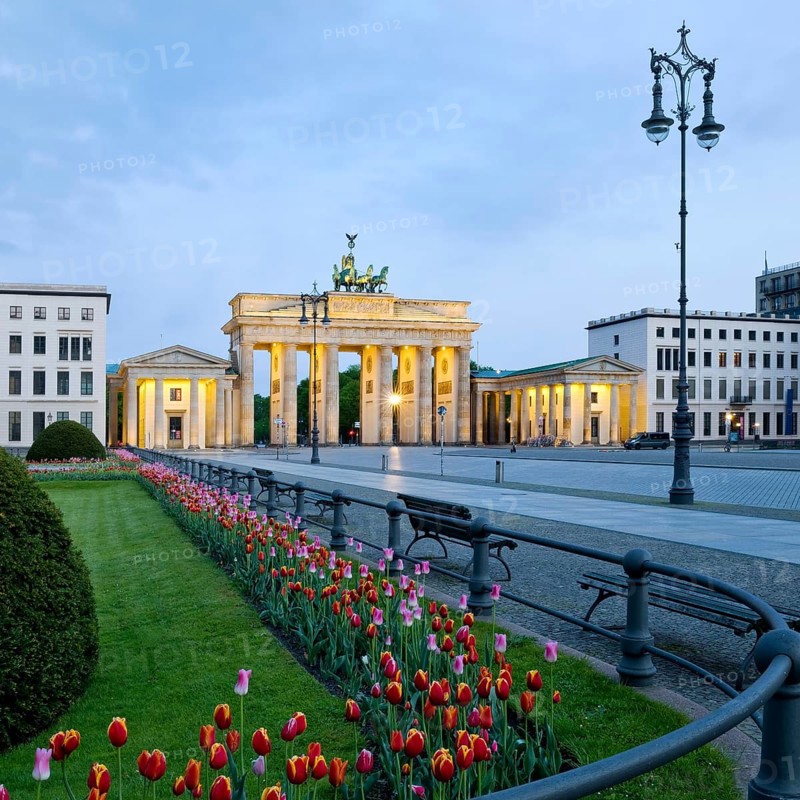 Illuminated Brandenburg Gate with Pariser Platz in the early morning