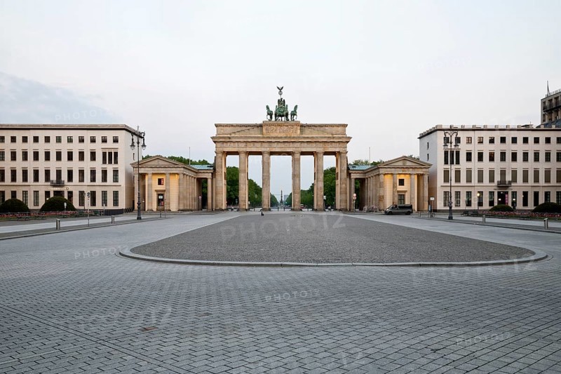 Brandenburg Gate with empty Pariser Platz in the early morning