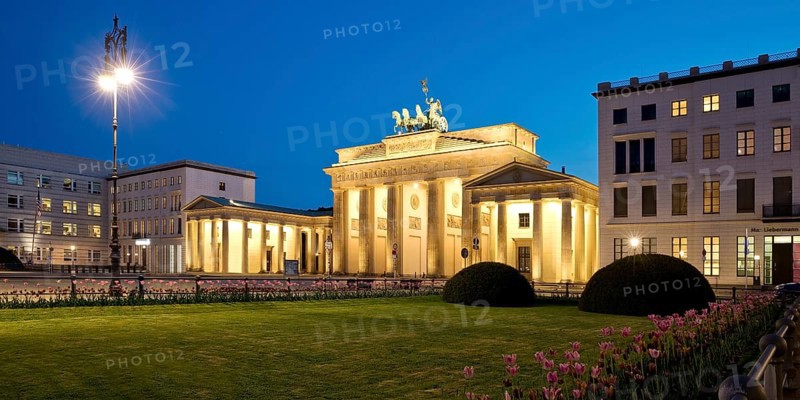 Illuminated Brandenburg Gate with Pariser Platz in the evening