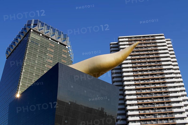Asahi Breweries headquarters building with the Asahi Flame by french designer Philippe Starck on the east bank of the Sumida River in Sumida district