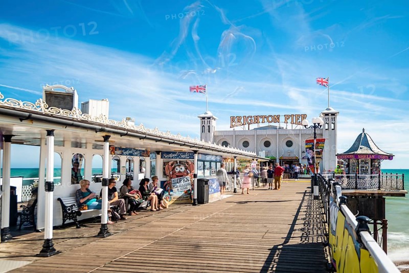 Tourists at Brighton Palace Pier with seagulls