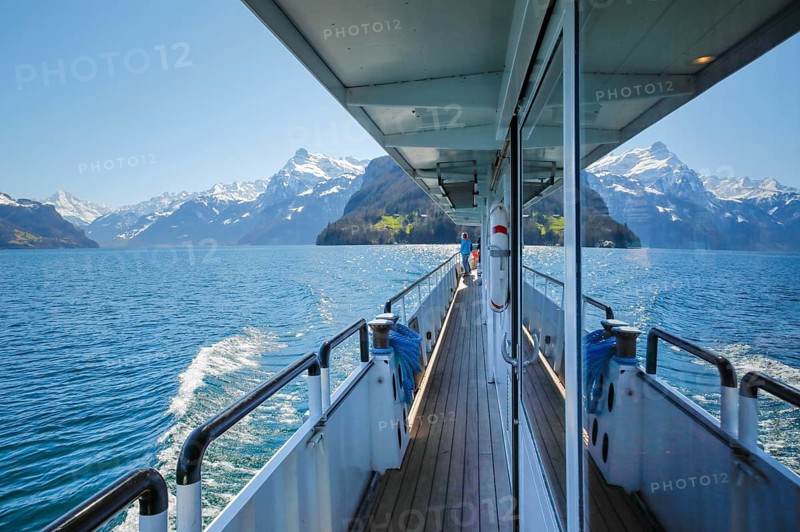 View of the Ruetli meadow during a boat trip on Lake Uri
