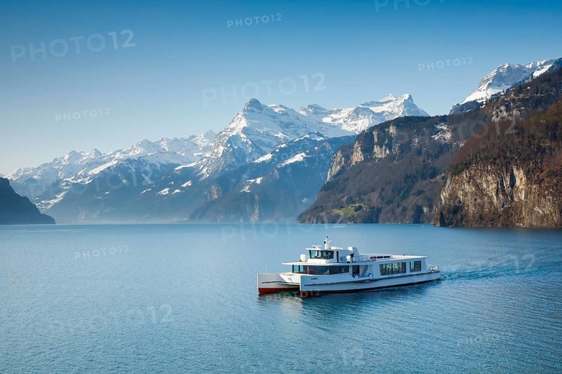 View from Brunnen on a boat on the Lake of Uri in front of the mountain scenery of the Alps of Uri