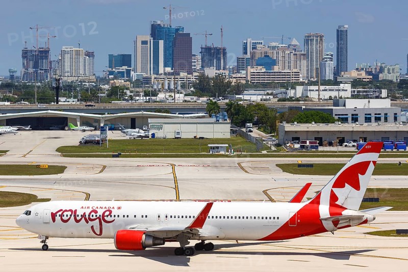A Boeing 767-300ER of Air Canada Rouge with the registration C-GHLT at Fort Lauderdale Airport