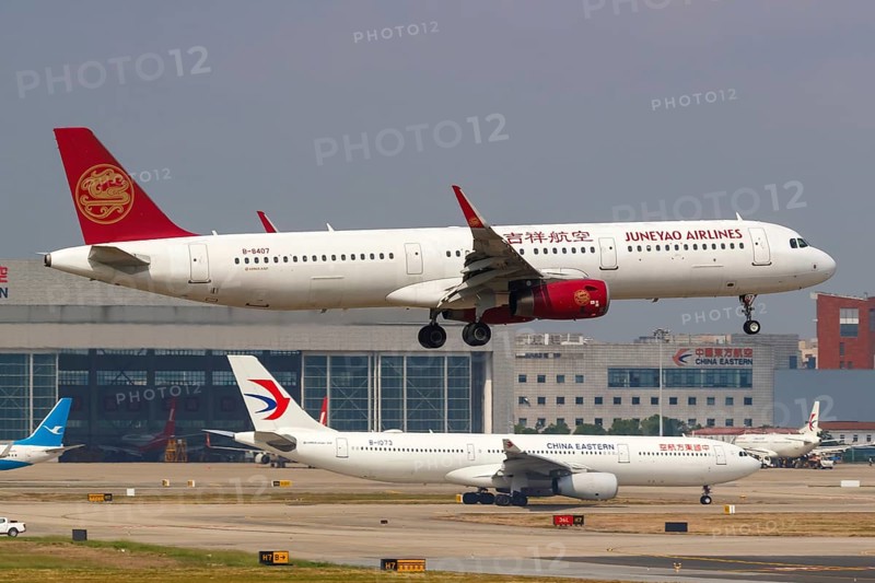 A Juneyao Airlines Airbus A321 with registration number B-8407 at Shanghai Hongqiao Airport